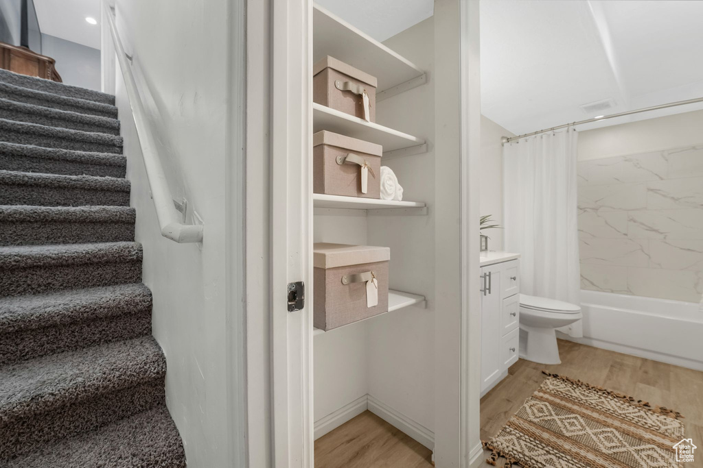 Stairway with wood finished floors
