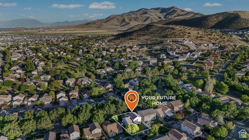 Aerial view of property and surrounding area featuring property parcel outlined and nearby suburban area