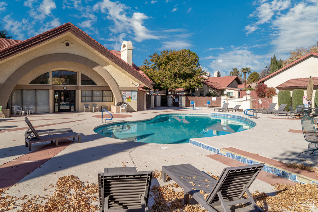Community pool featuring a patio