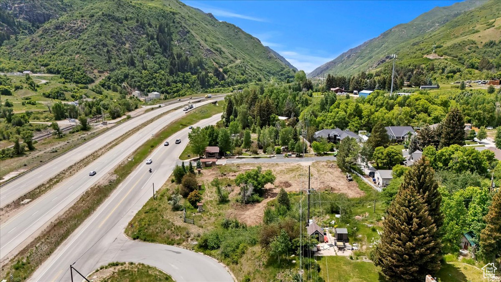 Drone / aerial view of a main thoroughfare and mountains