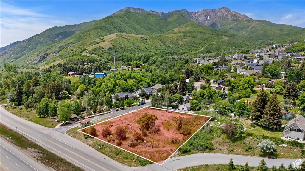 Aerial overview of property's location featuring property boundaries highlighted and mountains