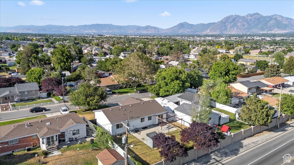 Aerial view of residential area featuring a mountainous background
