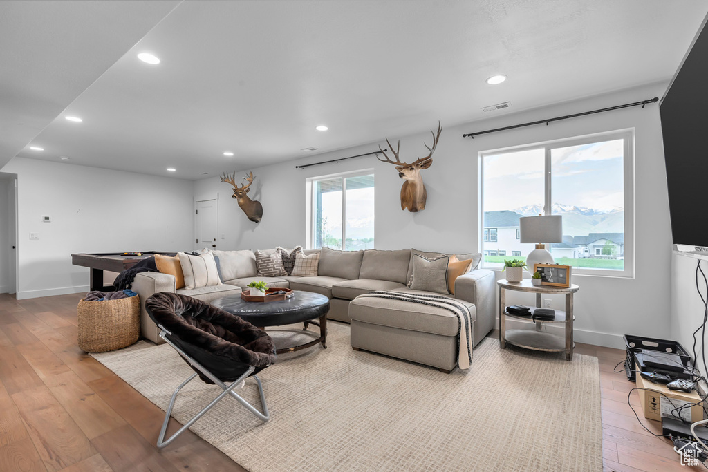 Living area with hardwood / wood-style flooring, pool table, and recessed lighting