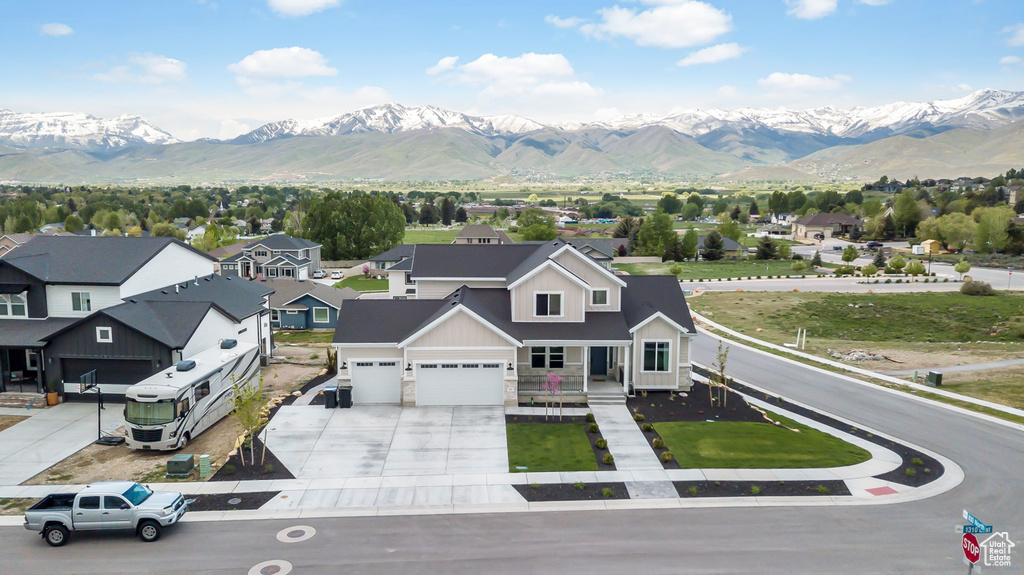 View of mountain backdrop featuring nearby suburban area