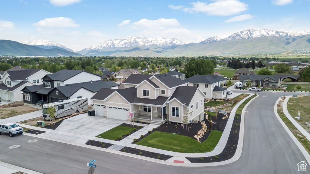 Aerial view of residential area featuring a mountainous background