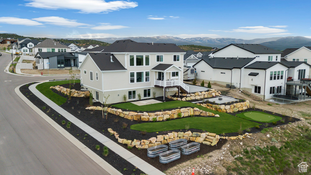 Aerial perspective of suburban area with a mountainous background