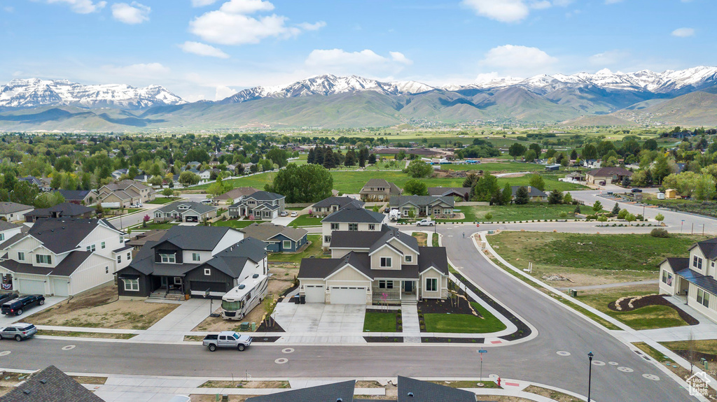 Aerial perspective of suburban area featuring a mountain backdrop