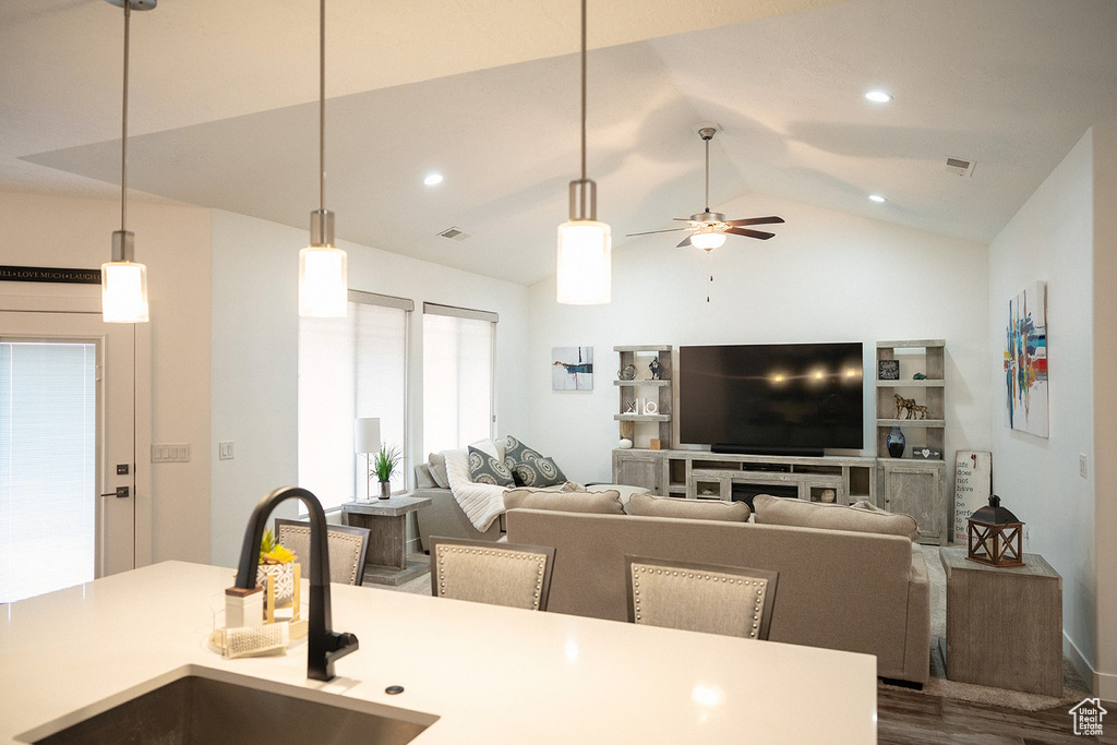 Living room with vaulted ceiling, dark wood-style flooring, a ceiling fan, and recessed lighting