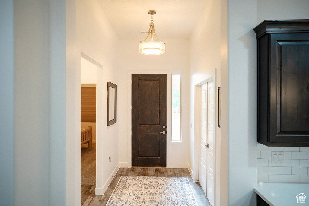 Entrance foyer featuring light wood-type flooring and baseboards