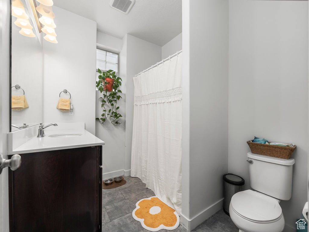 Full bath featuring vanity and a shower with shower curtain