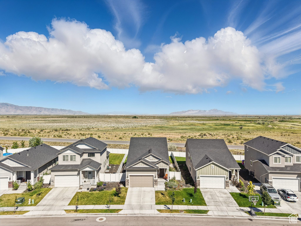 Aerial view of residential area featuring a mountain backdrop