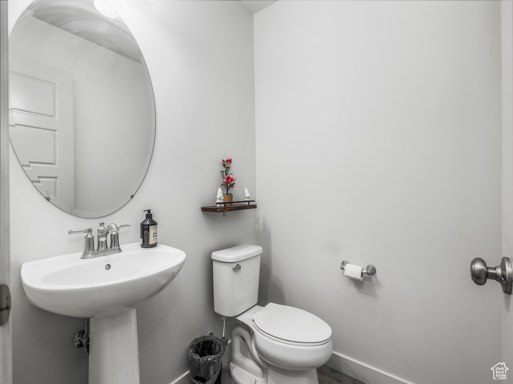 Half bathroom with baseboards