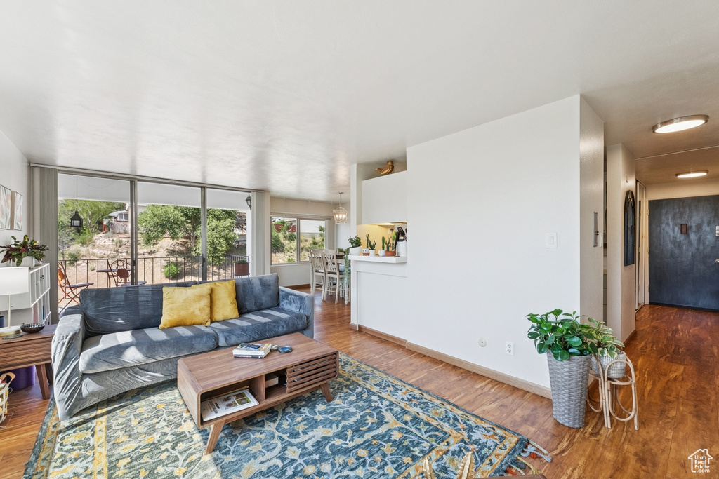 Living area with wood finished floors and baseboards