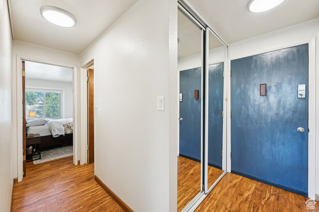 Hallway featuring wood finished floors