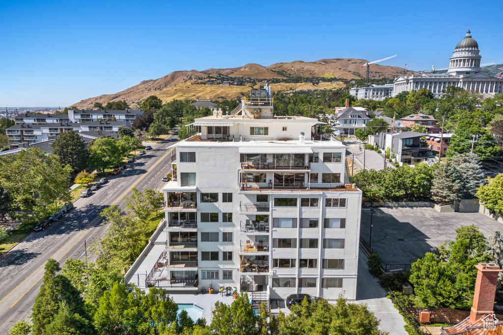 View of apartment building / complex featuring a mountain view