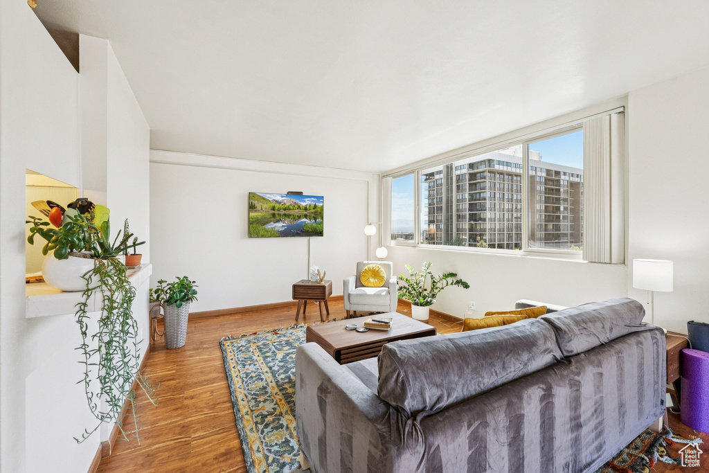 Living room featuring wood finished floors and baseboards
