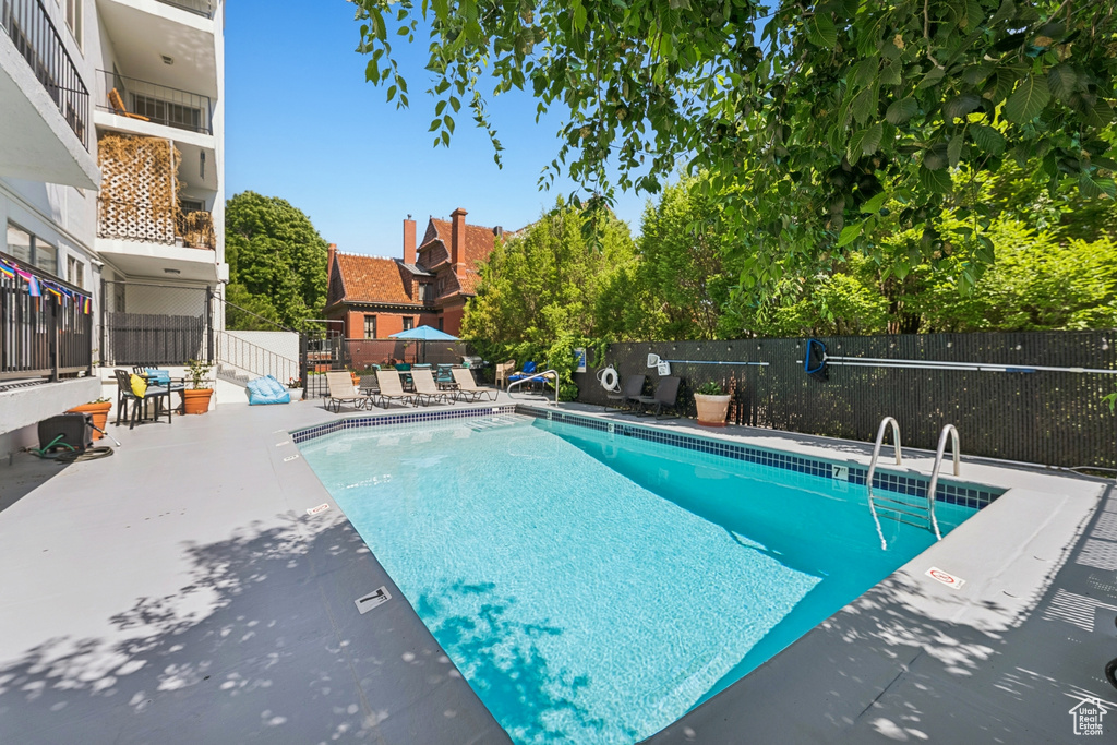 Community pool with a patio area