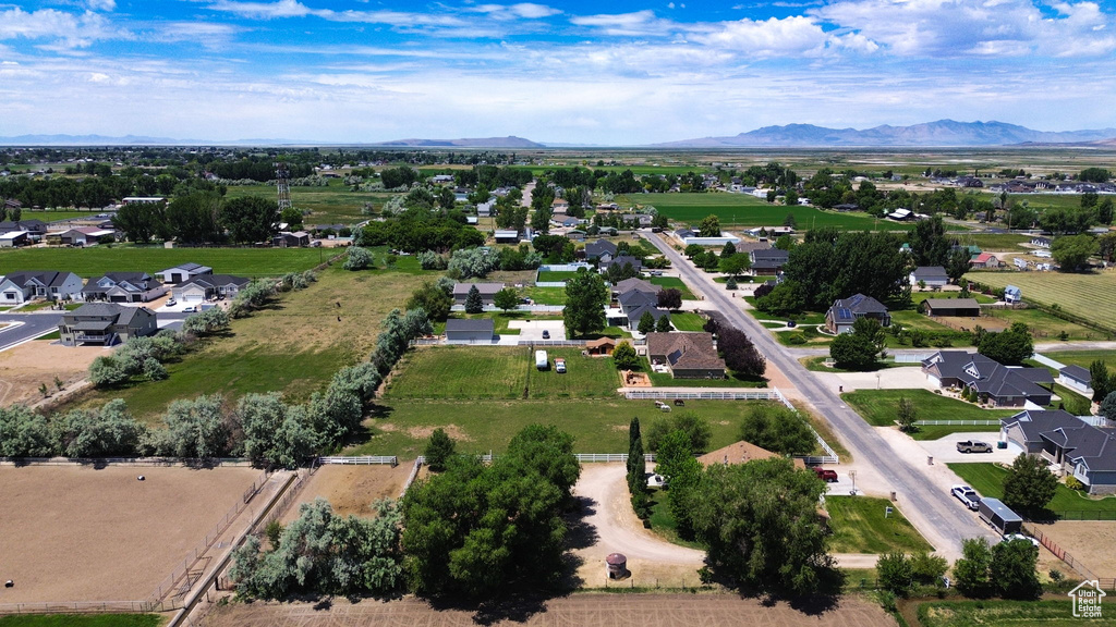Aerial overview of property\'s location featuring nearby suburban area and mountains