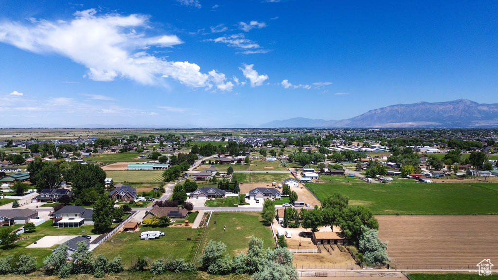 Aerial perspective of suburban area with a mountainous background