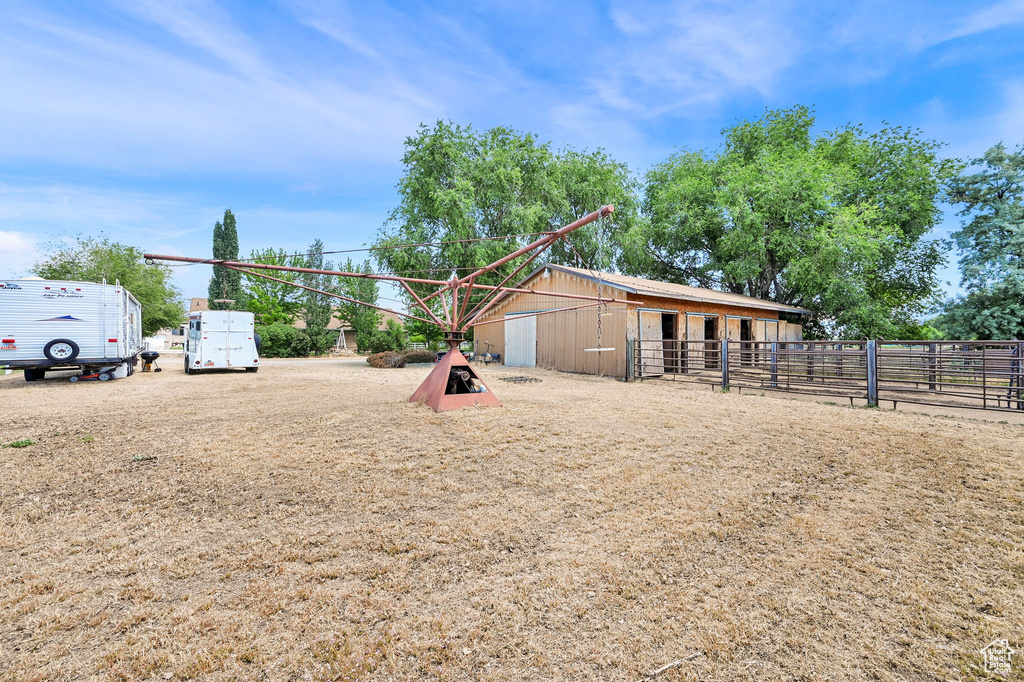 View of yard featuring an exterior structure and an outdoor structure