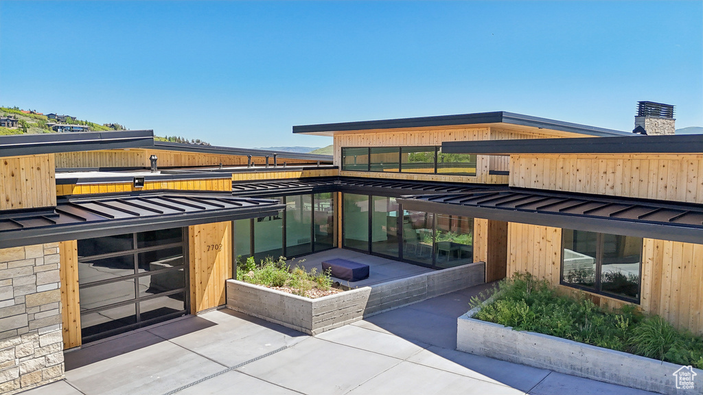 Exterior space with a standing seam roof and metal roof