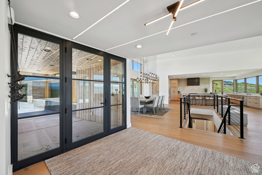 Interior space featuring wood finished floors, recessed lighting, and french doors