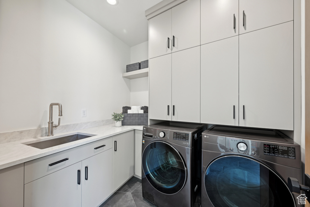 Laundry room featuring cabinet space, separate washer and dryer, and recessed lighting