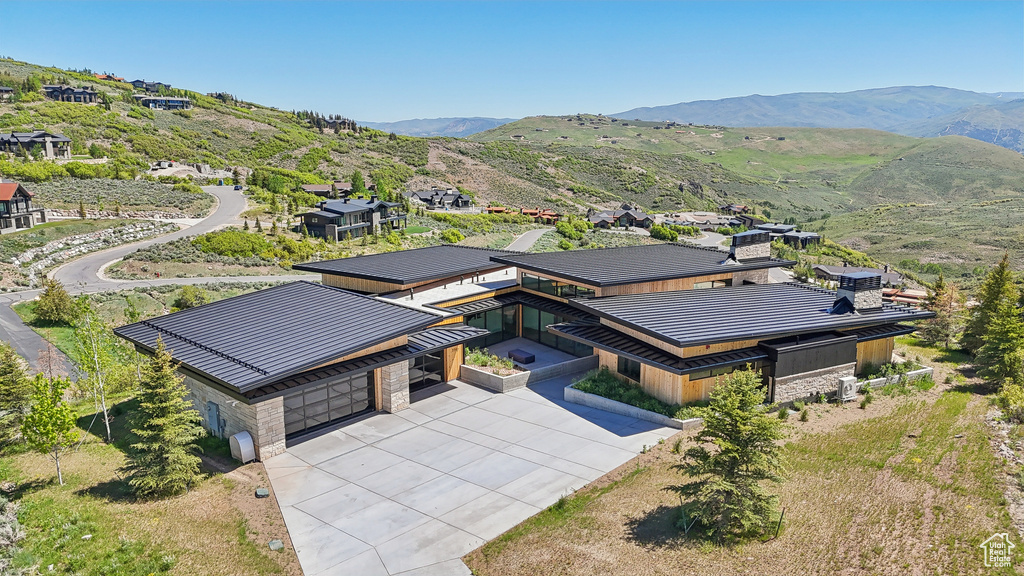 View of subject property with mountains