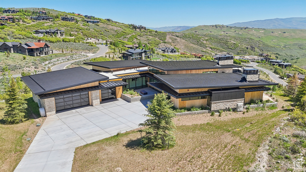 View of subject property featuring a mountain backdrop