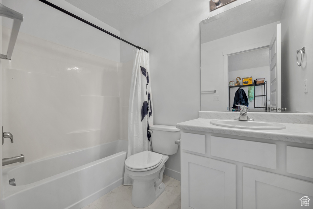 Full bathroom featuring vanity and shower / bath combo