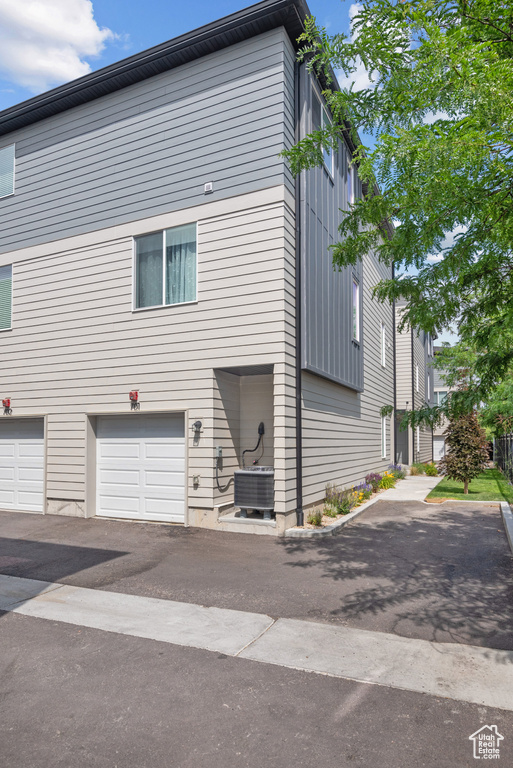 View of home\'s exterior with a garage and driveway