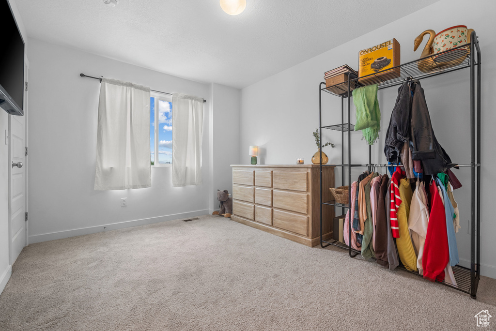 Bedroom with carpet and baseboards