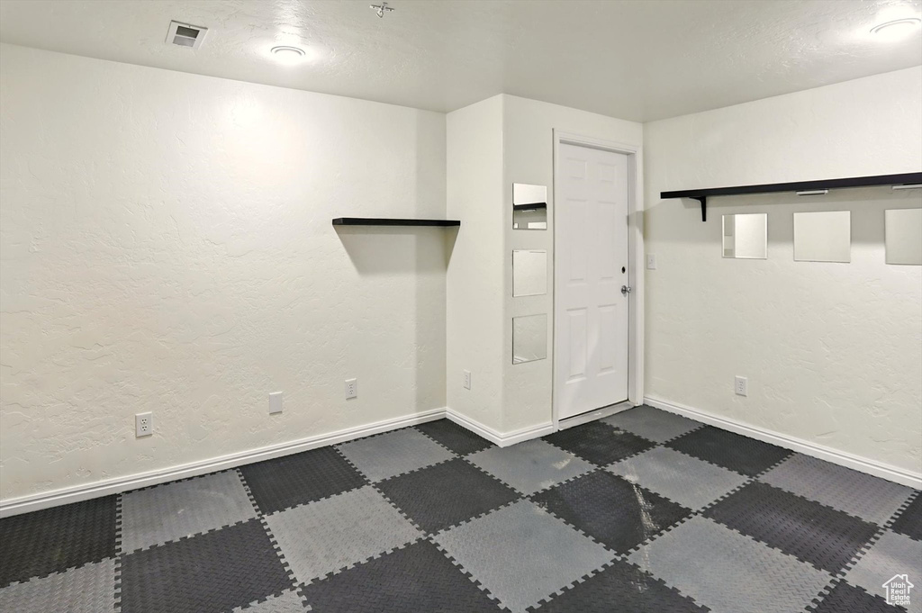 Unfurnished room with baseboards