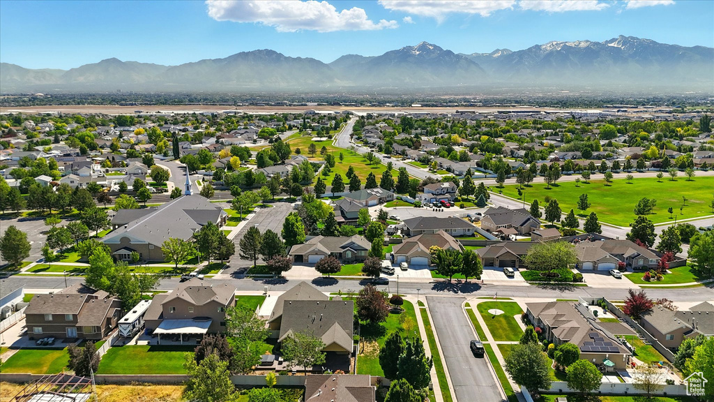 Aerial view of residential area with a mountainous background