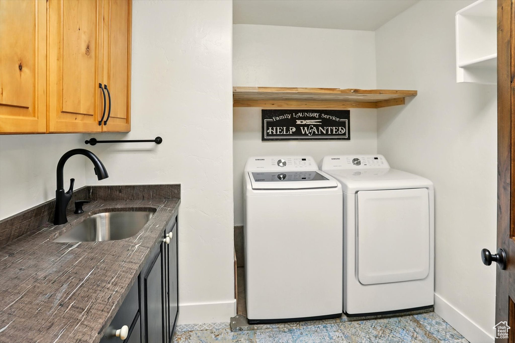 Laundry room with cabinet space and washer and dryer