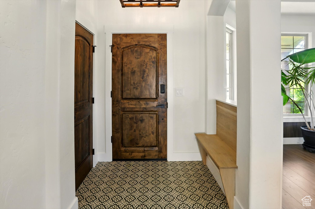 Foyer entrance with plenty of natural light and arched walkways