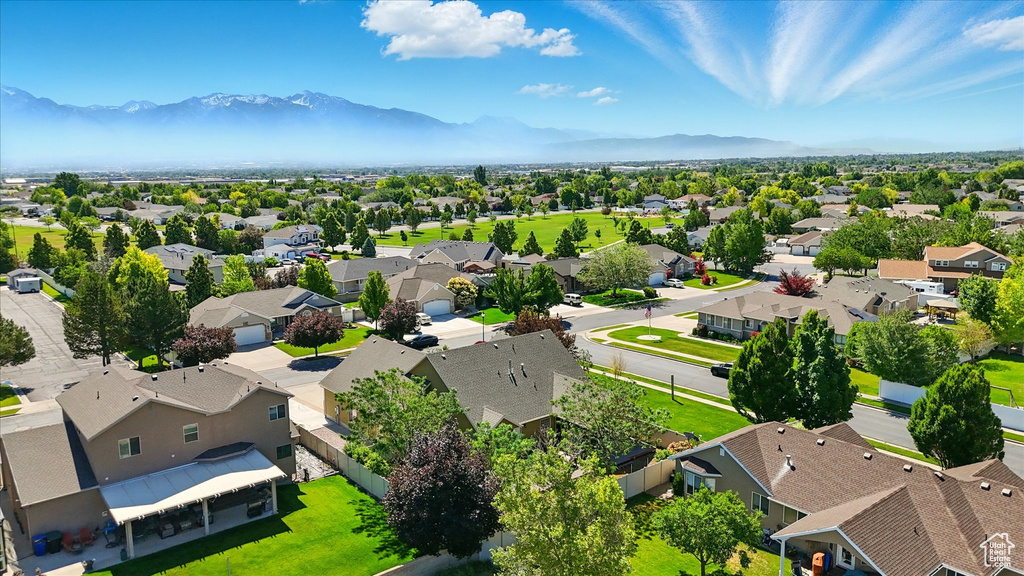 Aerial view of residential area featuring mountains