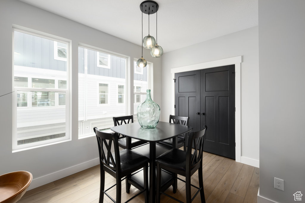 Dining room featuring baseboards and light wood-style floors