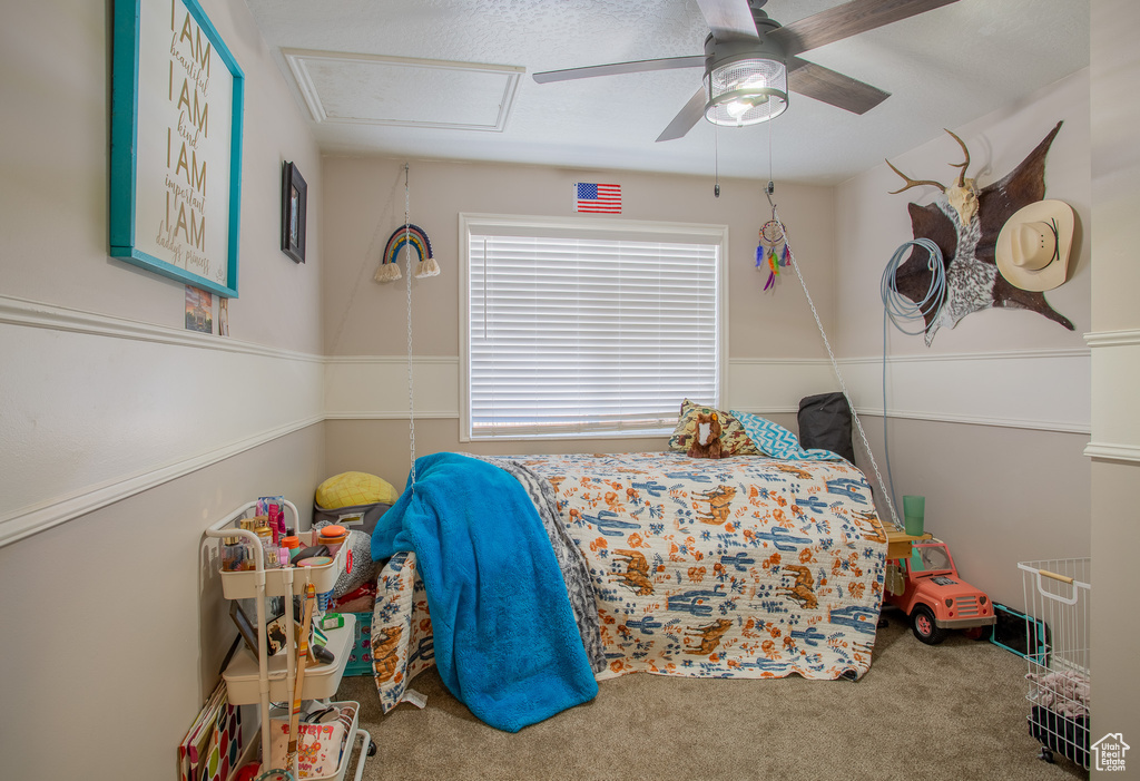 Bedroom featuring carpet flooring and a ceiling fan