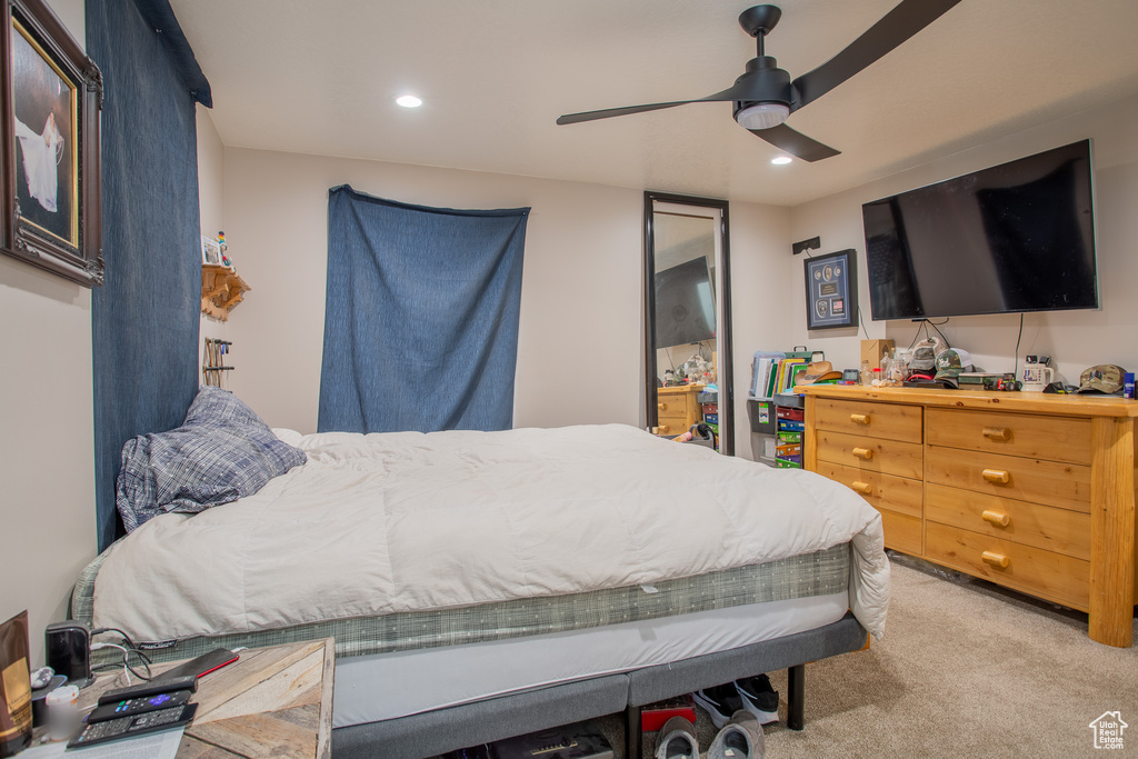 Bedroom featuring light carpet, recessed lighting, and ceiling fan