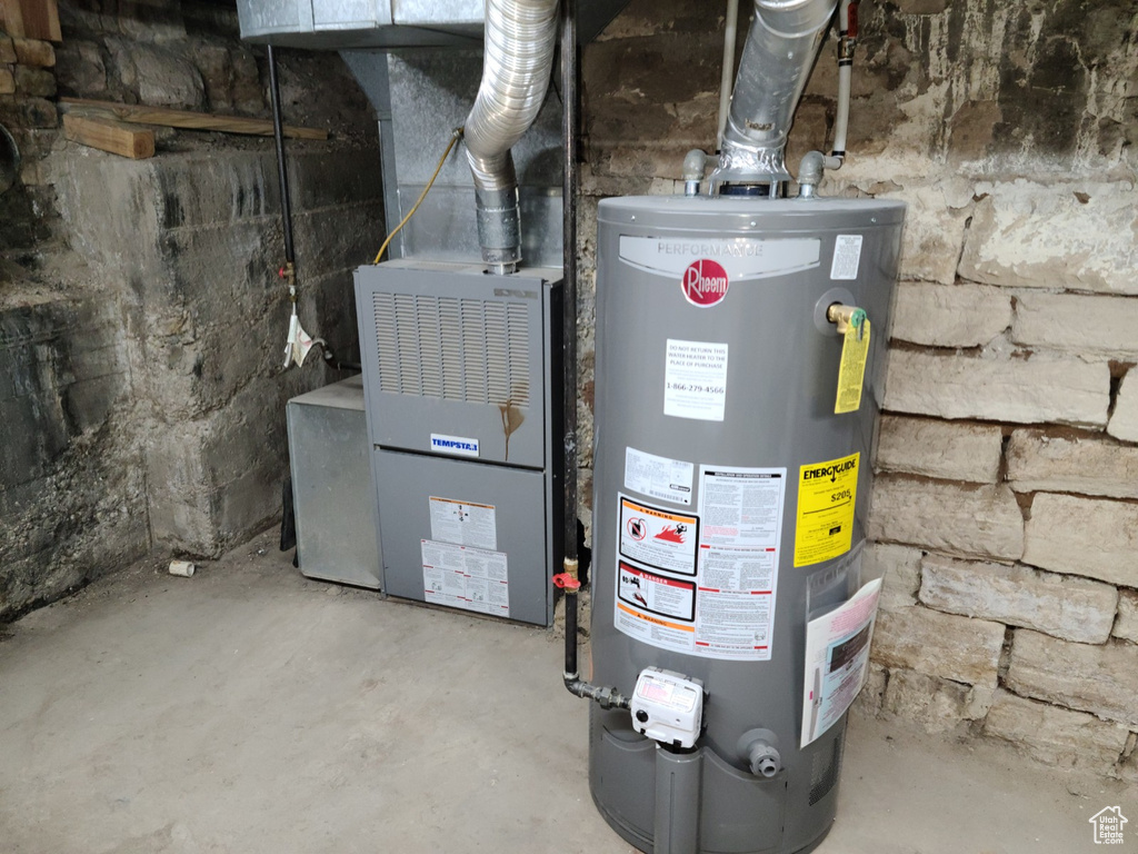 Utility room featuring gas water heater
