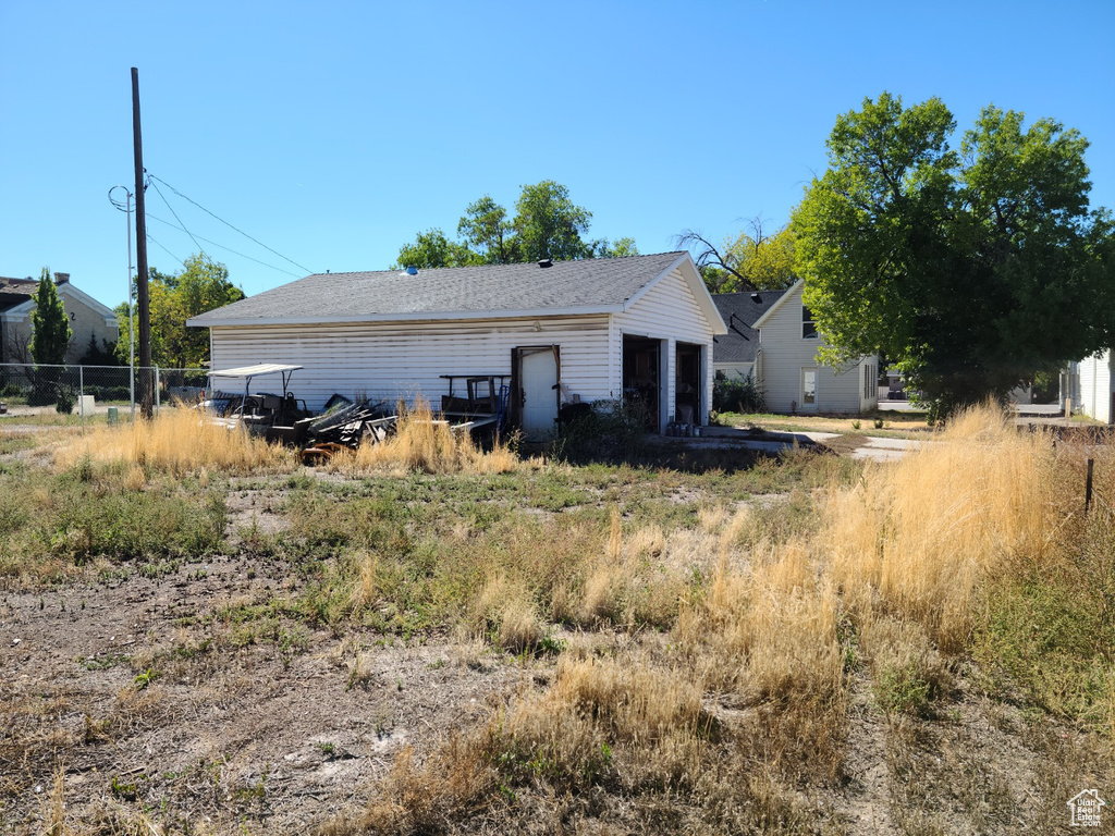 View of side of home featuring a garage