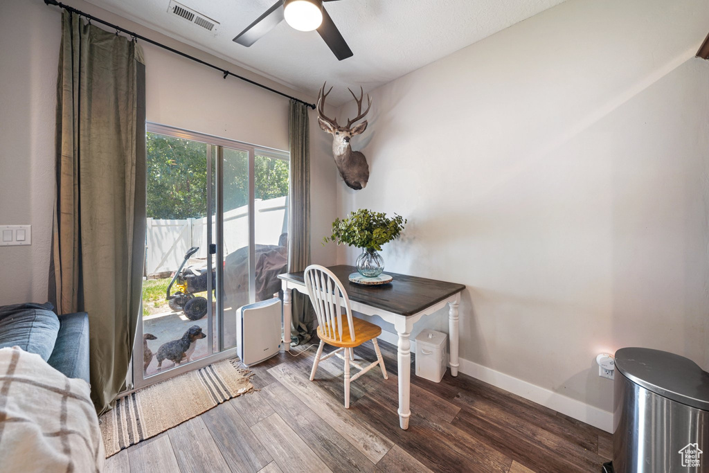 Home office with ceiling fan and wood finished floors