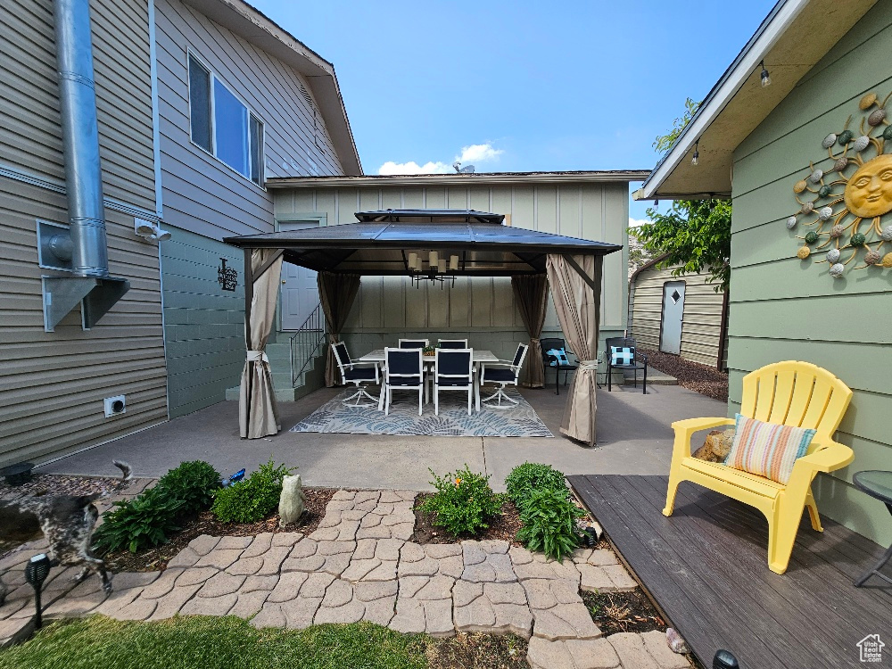 View of patio / terrace with a gazebo and outdoor dining area