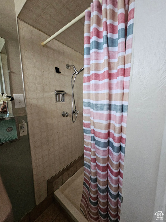 Full bathroom with a tile shower