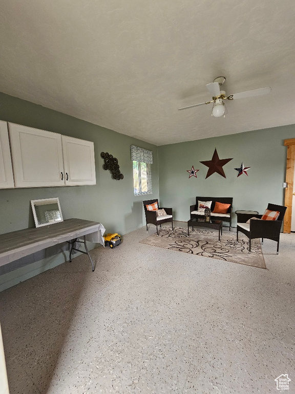 Living area featuring ceiling fan