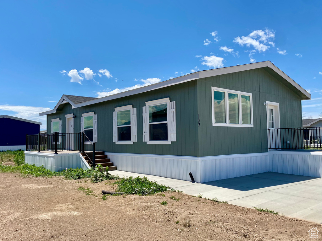 View of front of house with a patio area