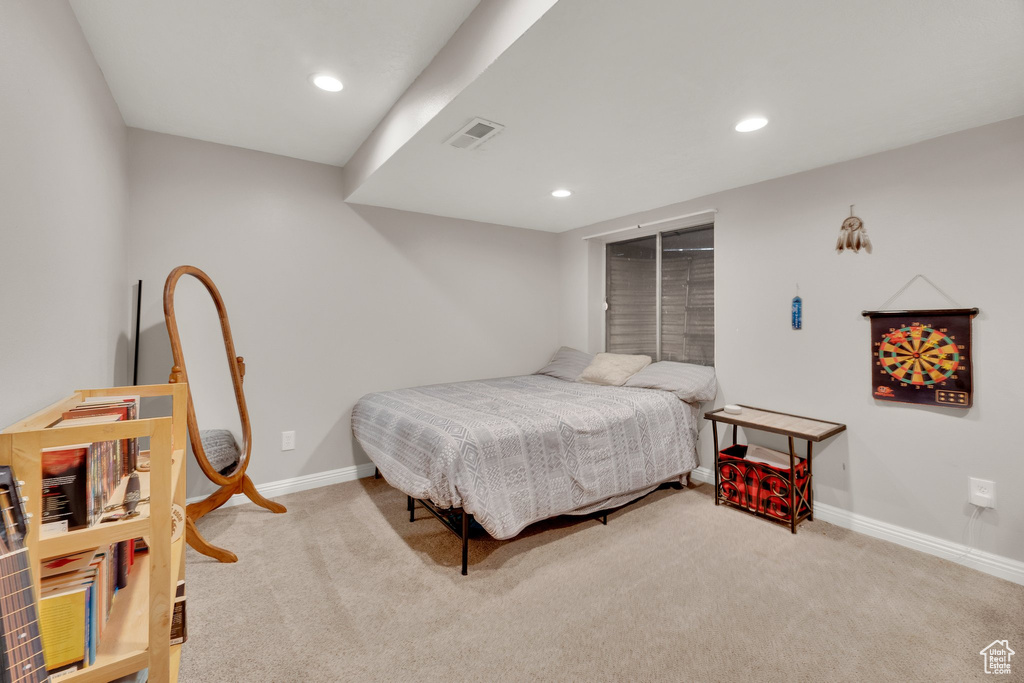 Carpeted bedroom with recessed lighting