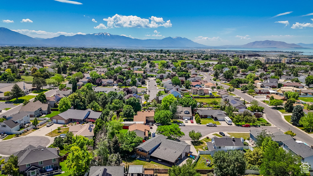 Aerial perspective of suburban area with a mountainous background