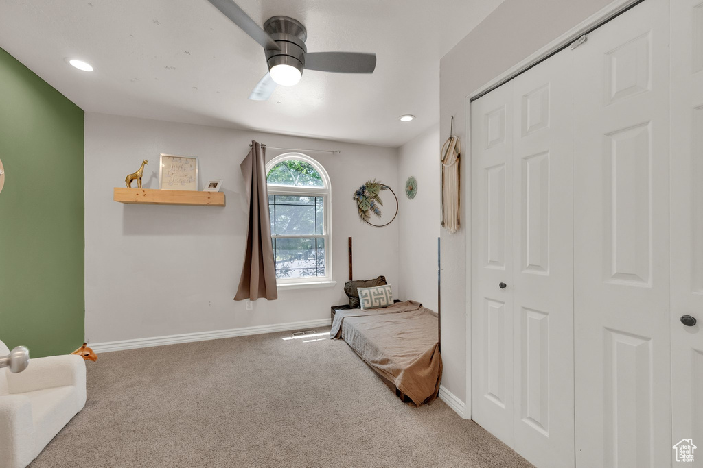 Sitting room with carpet flooring, a ceiling fan, and recessed lighting